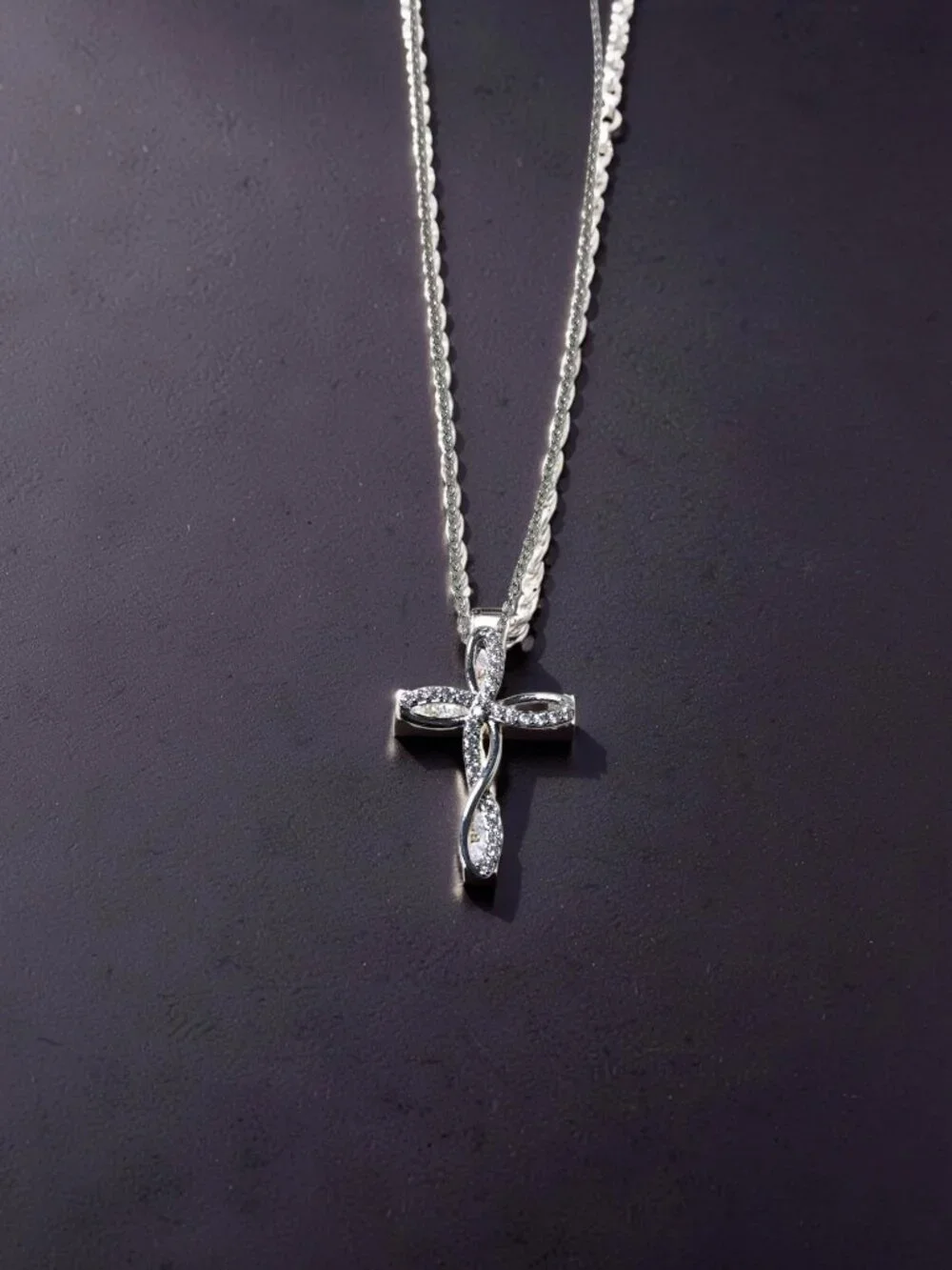 vintage Chrystal lined spiraled curled cross on a .925 sterling necklace